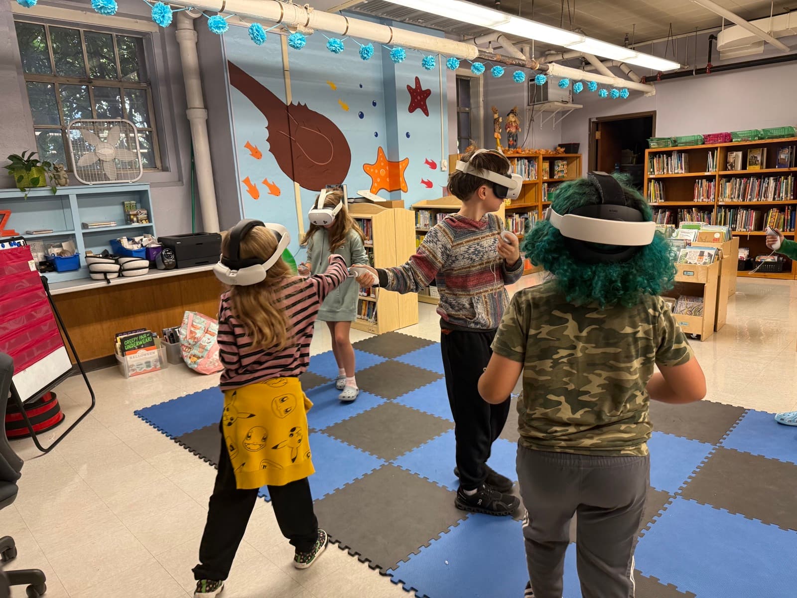 Students exploring careers together in VR headsets during a classroom program